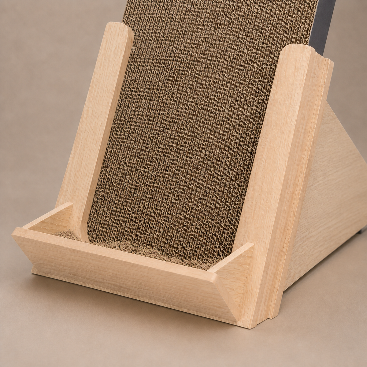 Loose cardboard flakes caught inside the Basic Incline Cat Scratcher front tray