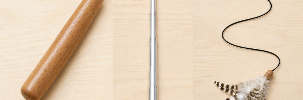 Close view of the wood handle, seven-section silver shaft, black line, and feather lure