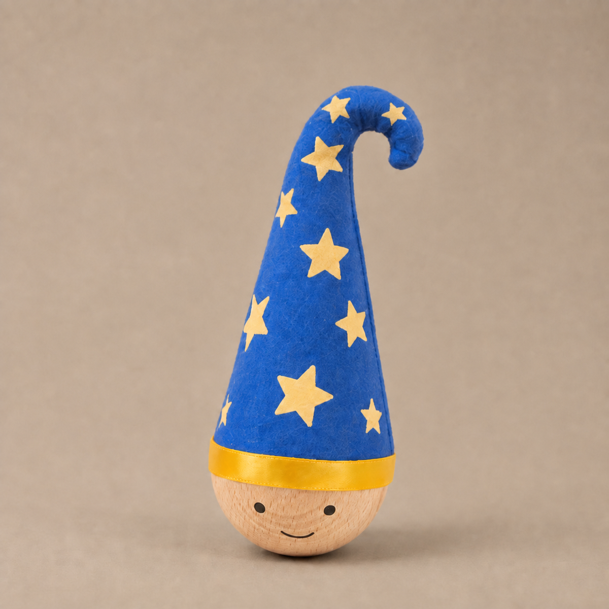 Boy (Blue) Wobble Toy, one item with a curled blue hat and yellow stars. in use