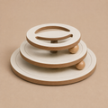 Wooden Ball Tower on a warm solid studio background