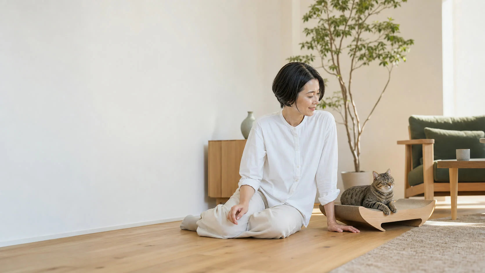 A person and cat sharing a calm living room